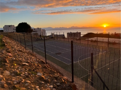 Clear View fencing and cantilever gate system securing a government facility in North West