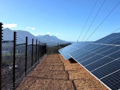 Solar farm fencing installation with anti-climb welded mesh panels, securing renewable energy infrastructure and solar power assets.