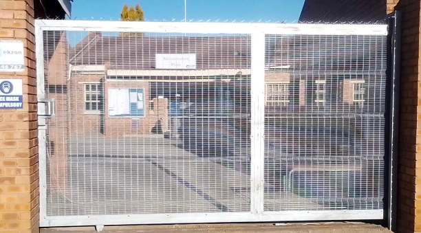 Heavy-duty sliding gate integrated with Clear View fencing for secure property access and perimeter control